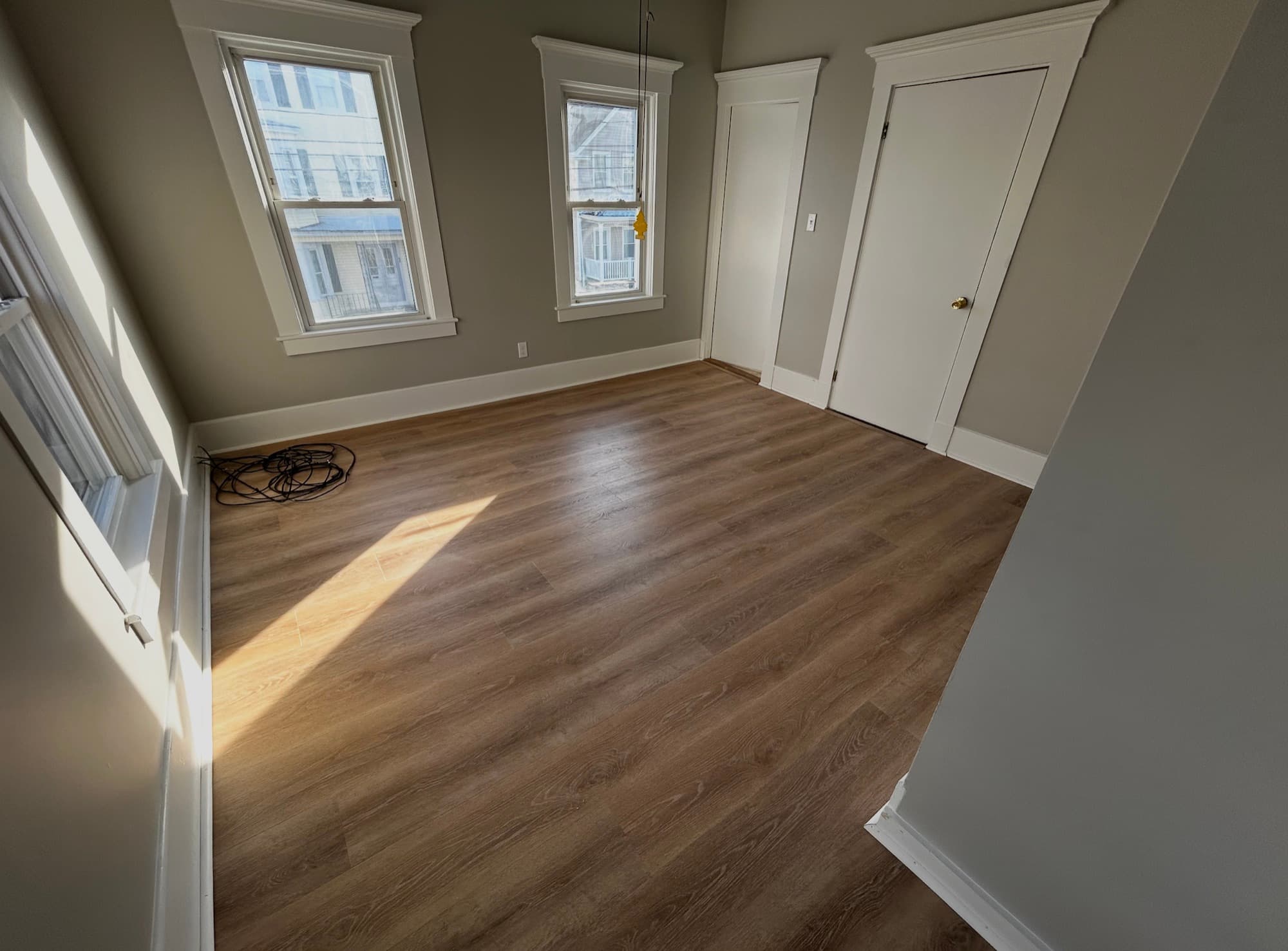 Luxury vinyl plank flooring and fresh trim by Harborview Home Improvements